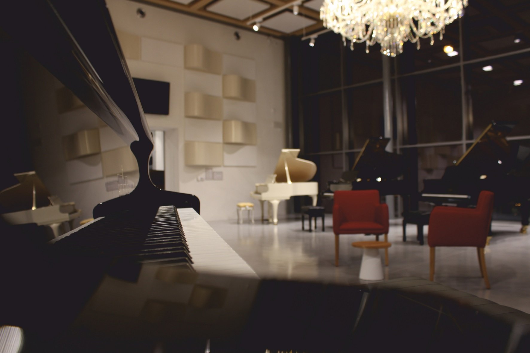What is the size of the grand piano and the upright piano?